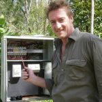 Man Next to Electrical Box | Electrician in Darwin, NT